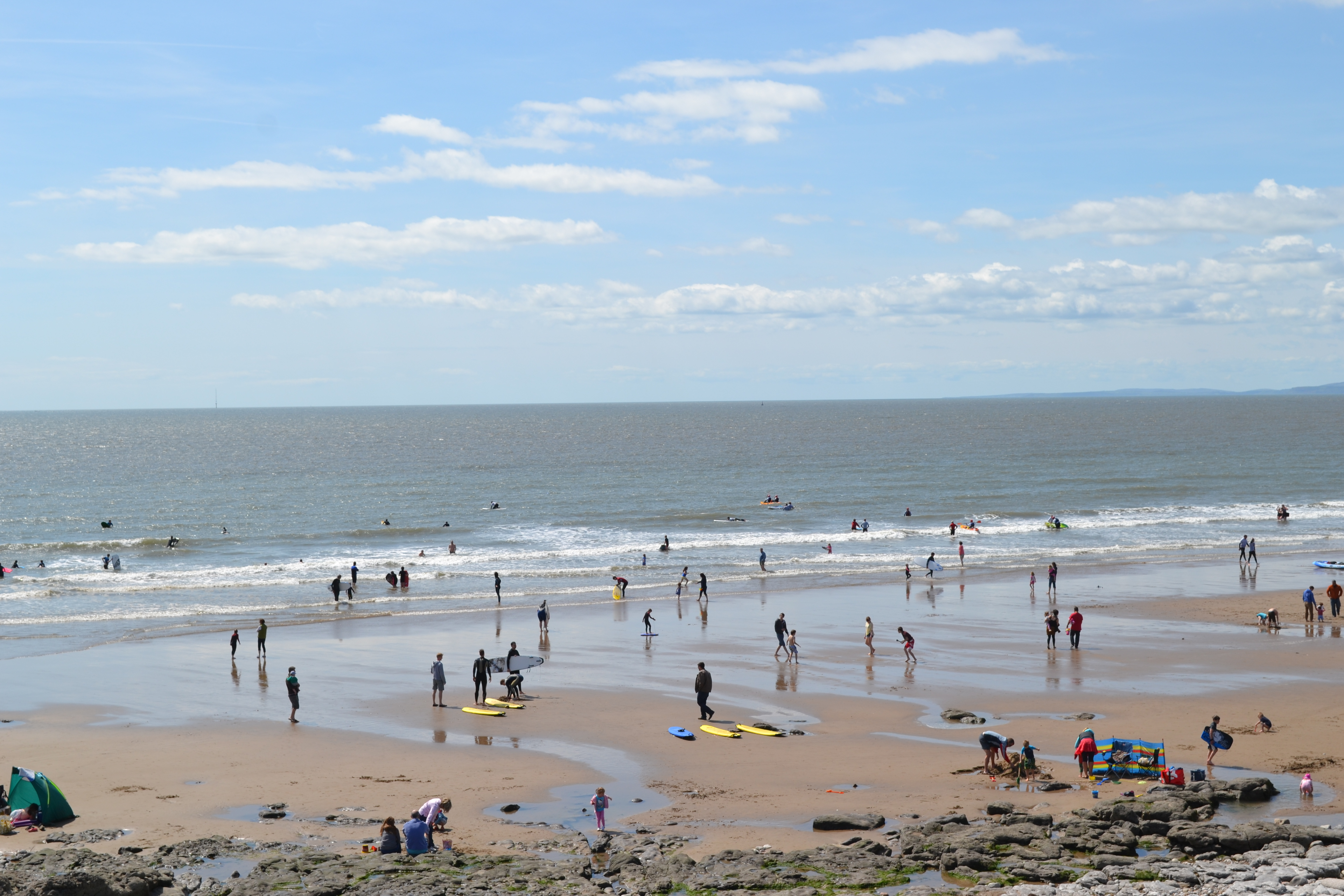 Visitors enjoying the beach at Rest Bay