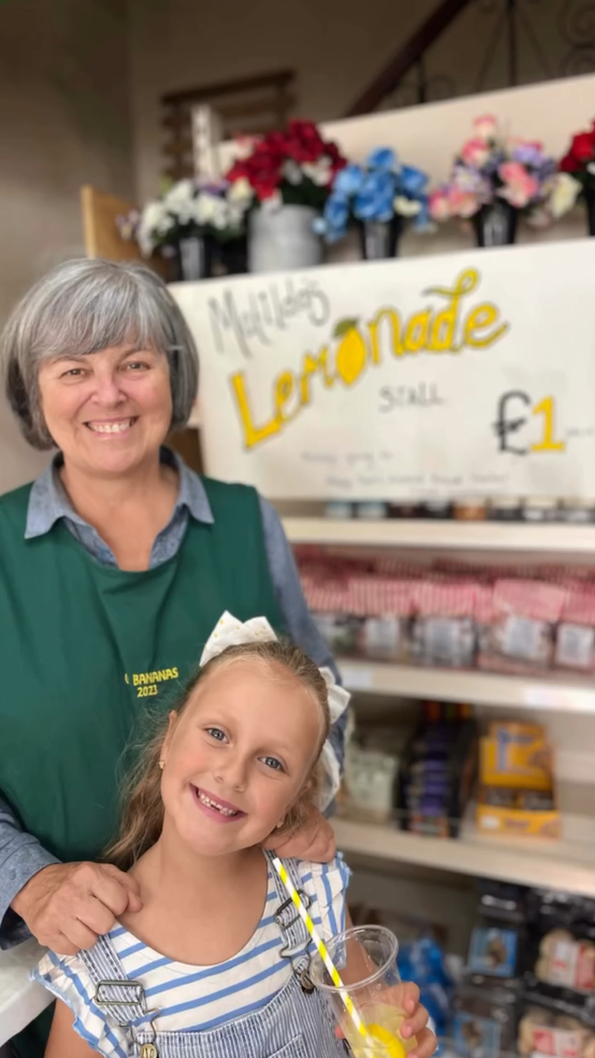 Matilda, 6, with her grandmother Hayley Morgan, outside her lemonade stand in Go Bananas in Maesteg Market.