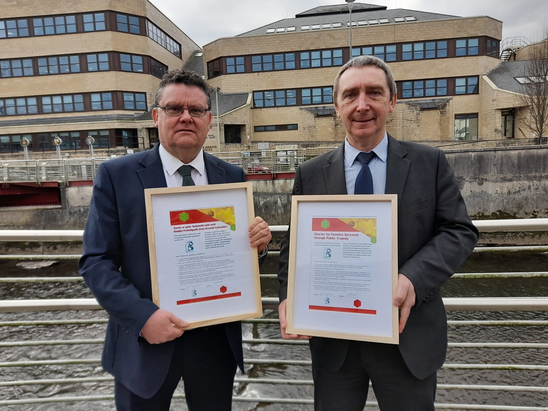 Chief Executive Mark Shephard pictured with the charter alongside Council Leader John Spanswick