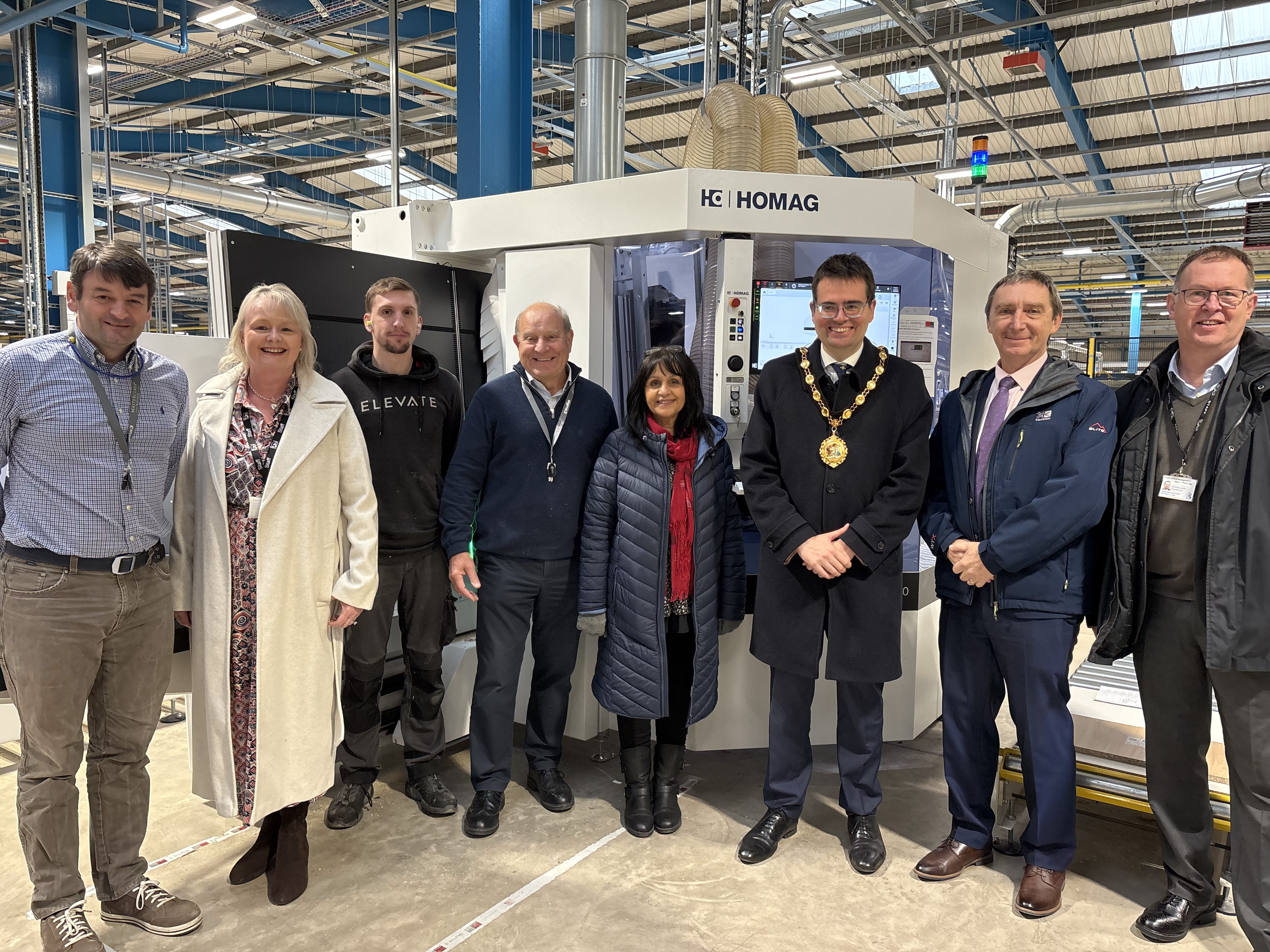 (L-R) Paul Crutcher, Operations Director at Sigma 3 Kitchens, Tracy Mortimer, Local Enterprise Coordinator at Bridgend County Borough Council, Brian Lakin, Chairman at Sigma 3 Kitchens, Councillor Neelo Farr, Cabinet Member for Regeneration, Economic Development and Housing, Councillor Huw David, Mayor of Bridgend County Borough, Simon Richards, Local Enterprise Coordinator at Bridgend County Borough Council and John Spanswick, Leader of Bridgend County Borough Council at Sigma 3 Kitchens.
