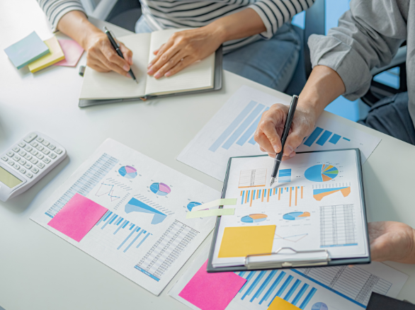 Two people looking at statistics