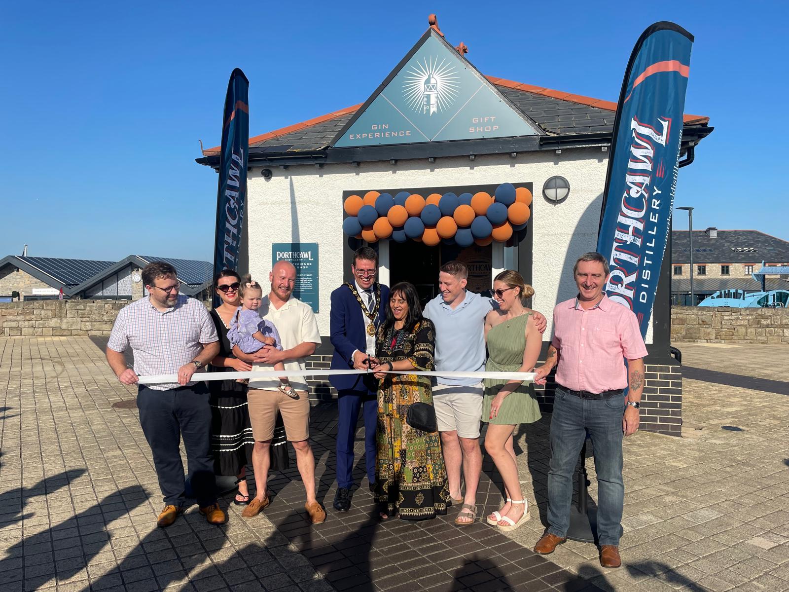 Glenn, Chris and their families with the Mayor of Bridgend County Borough Cllr Huw David and Cabinet Member, Cllr Neelo Farr at the official opening of their premises.