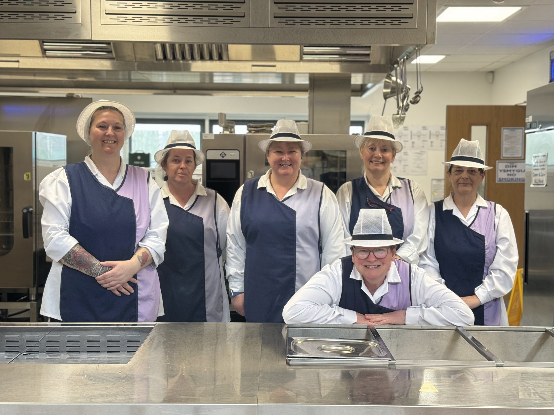 Catering staff in school kitchen