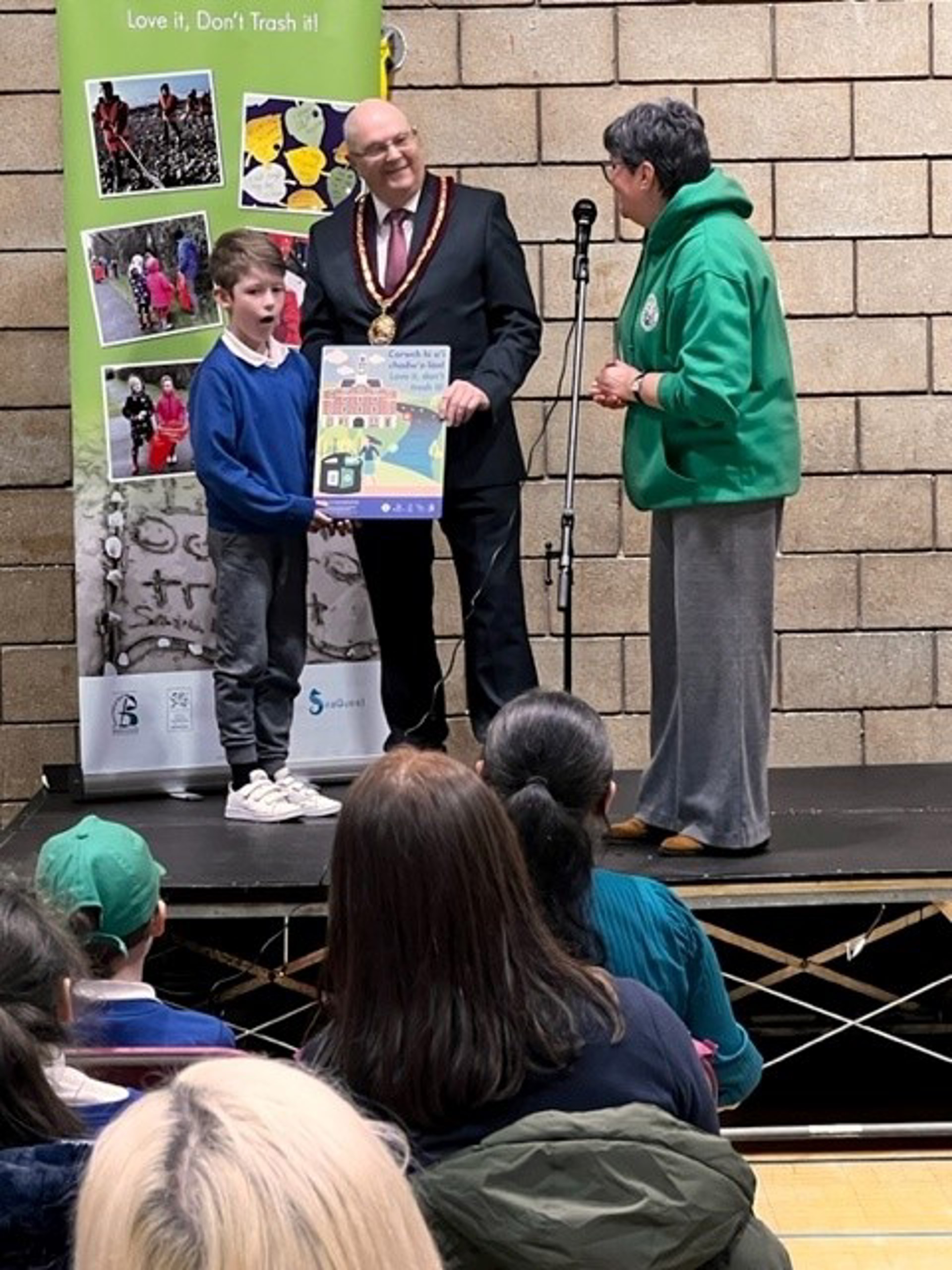 Pupil receiving award for his poster