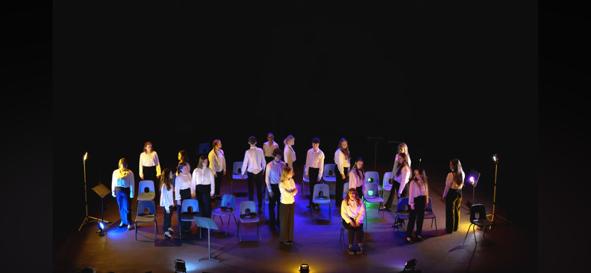 Students from Porthcawl Comprehensive School on stage