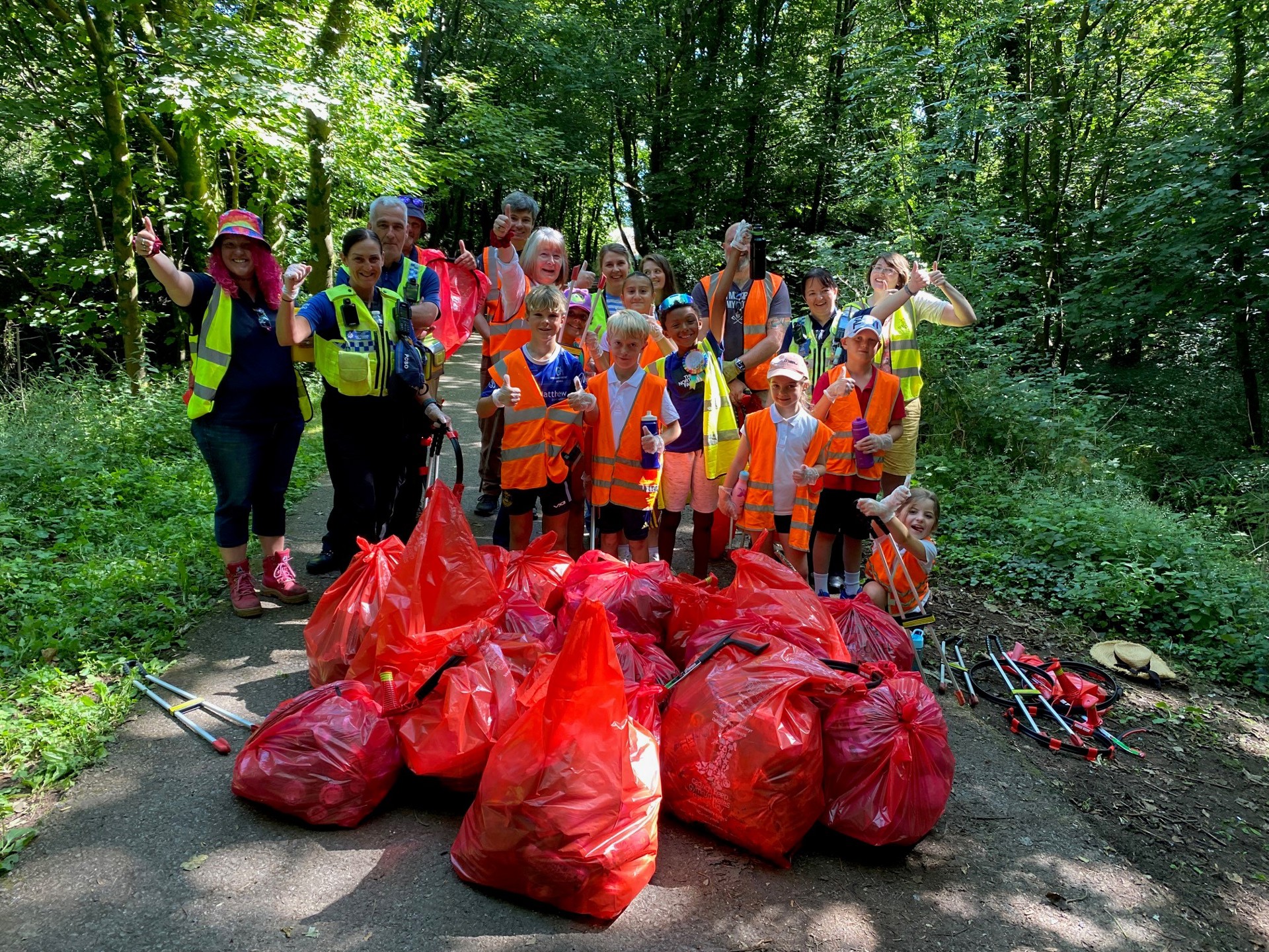 Cllr Jane Gebbie pictured with pupils and teachers from the school and members of local community groups showing the amount of rubbish they have collected.