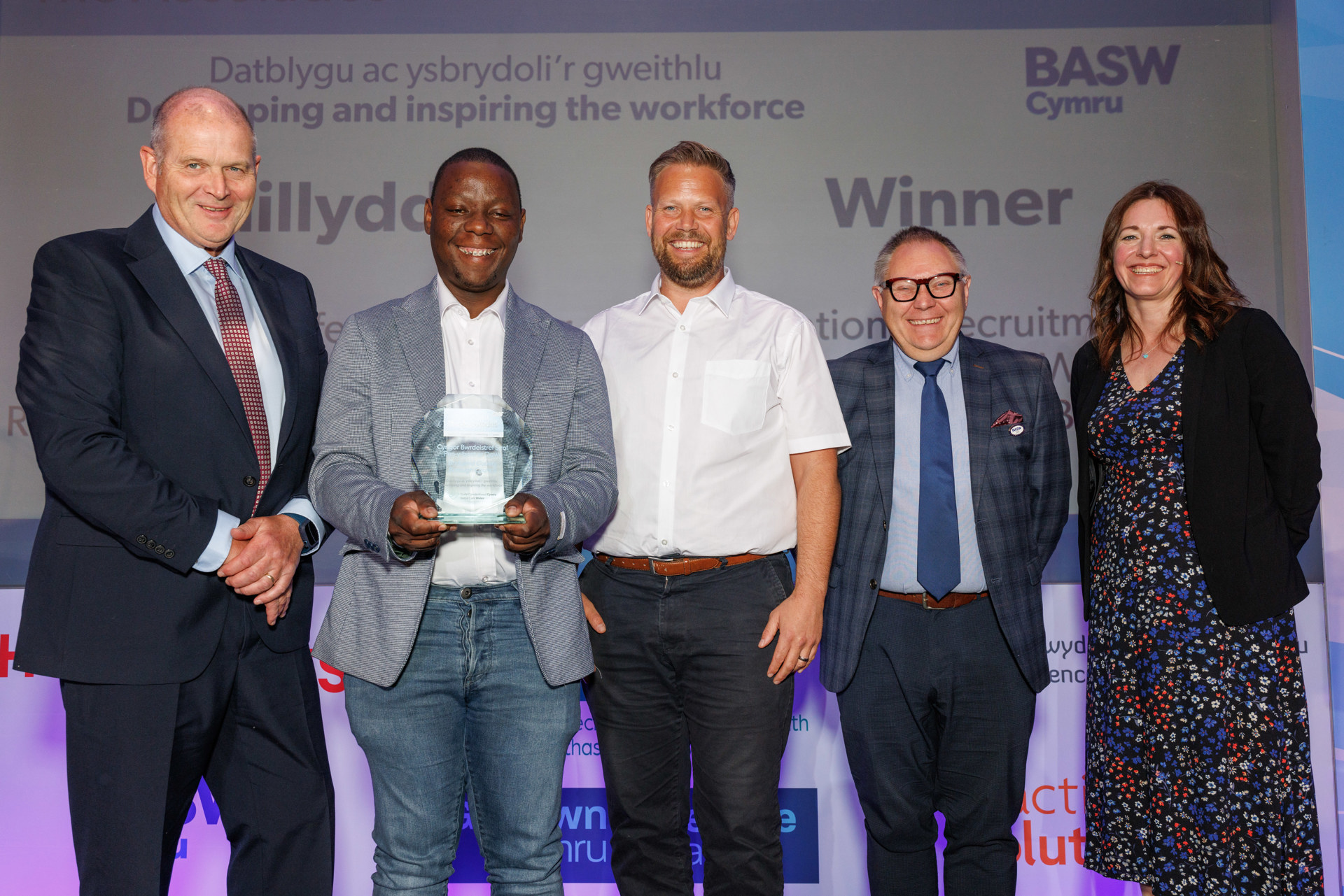 Members of Bridgend Council’s ‘International Recruitment Programme for Children's Social Workers’ receiving a Social Care Wales Award earlier this year.