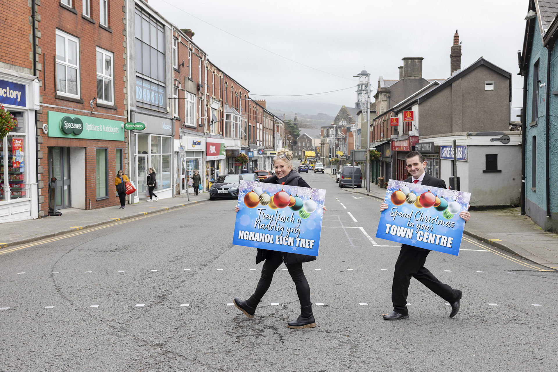 Cabinet Members for Resources Councillor Melanie Evans and Councillor Eugene Caparros in Maesteg town centre