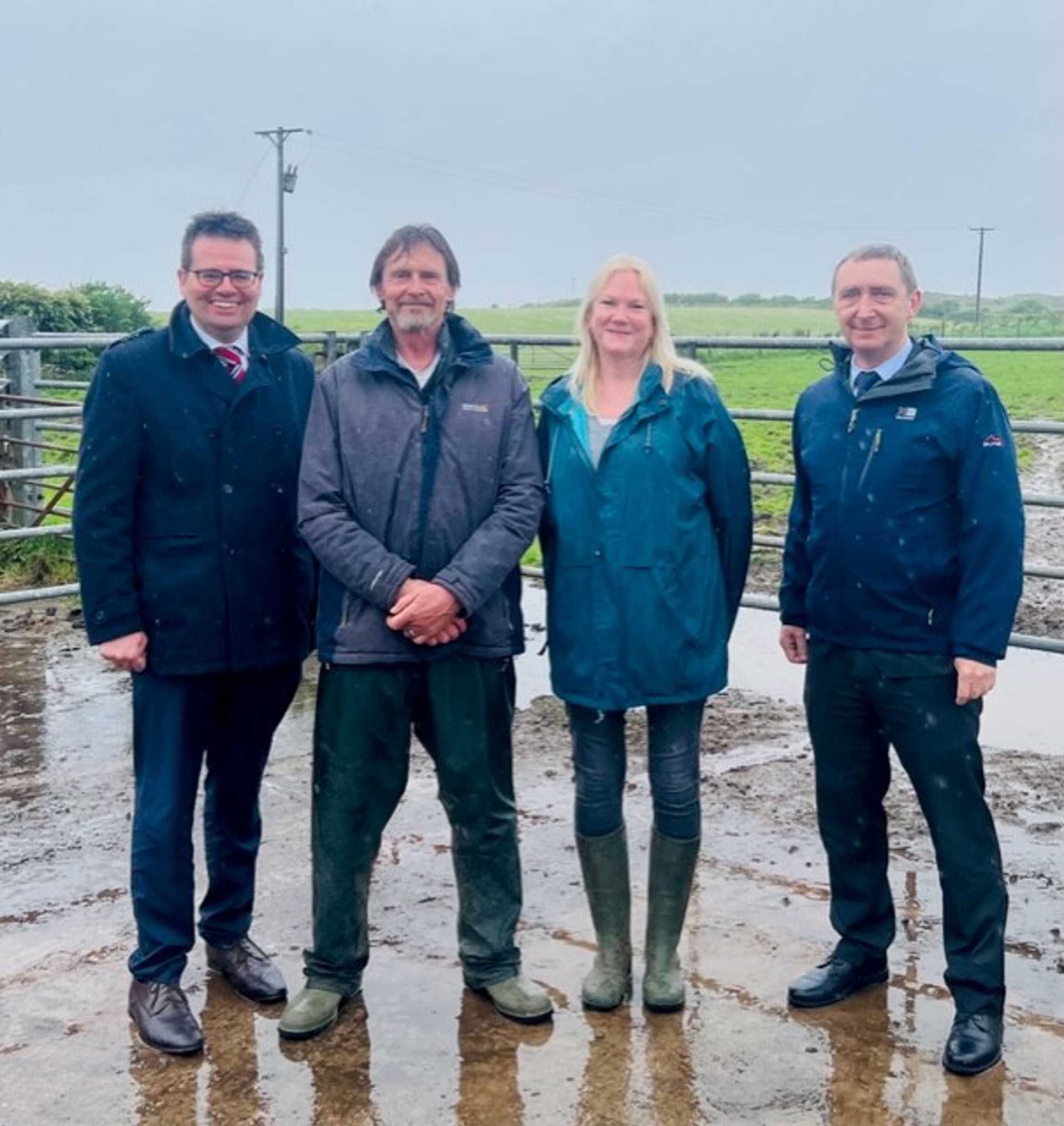 From left to right in image in front of the field - Council Leader, Huw David, farmer, Tony Evans and wife, Lesley Evans, Cllr John Spanswick