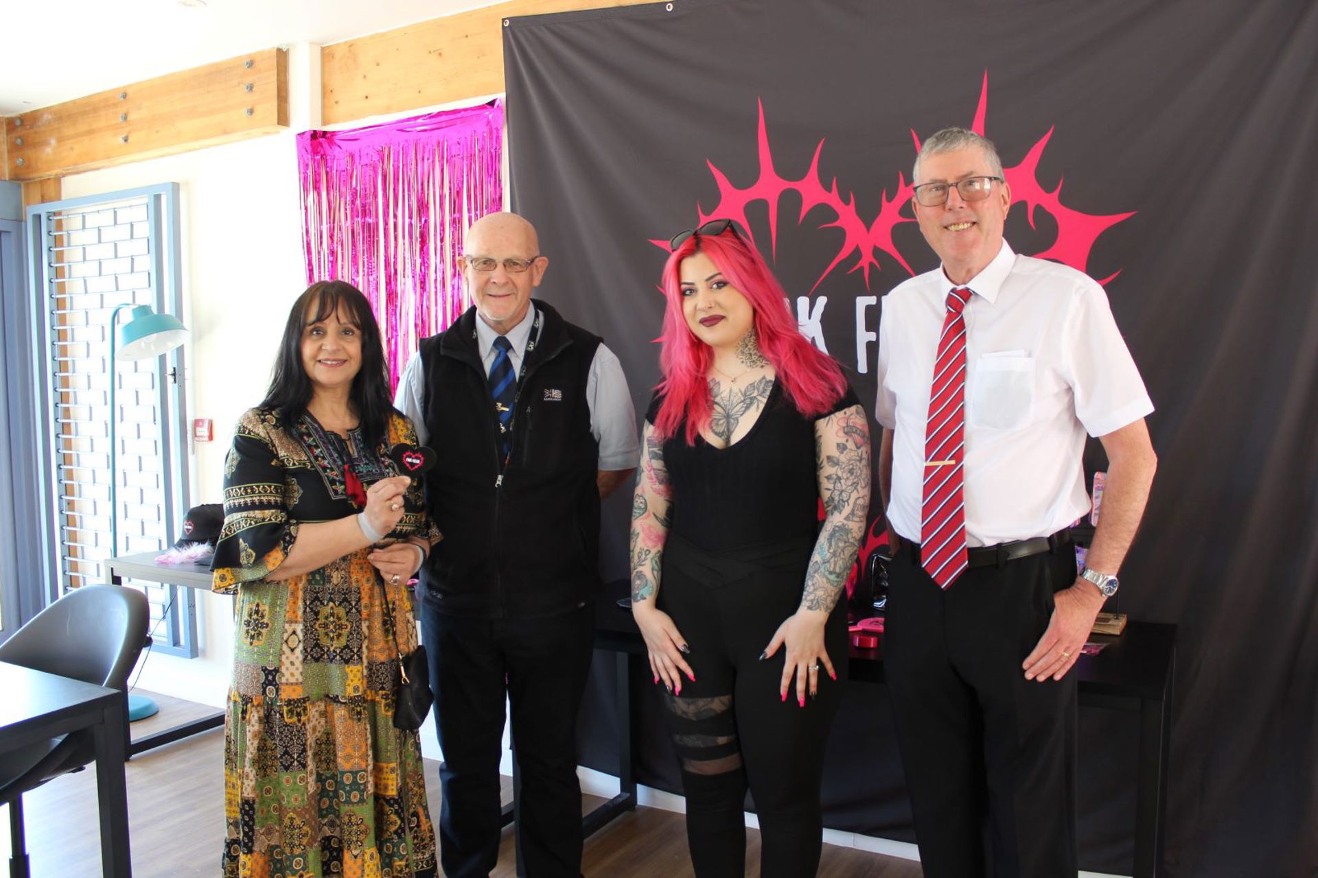 Councillor Neelo Farr, Cabinet Member for Regeneration, Economic Development and Housing, Councillor Paul Davies, Athina Konstantinou, owner of Pink Freak Boutique and Councillor Martin Hughes in the Maesteg Market pop up unit.