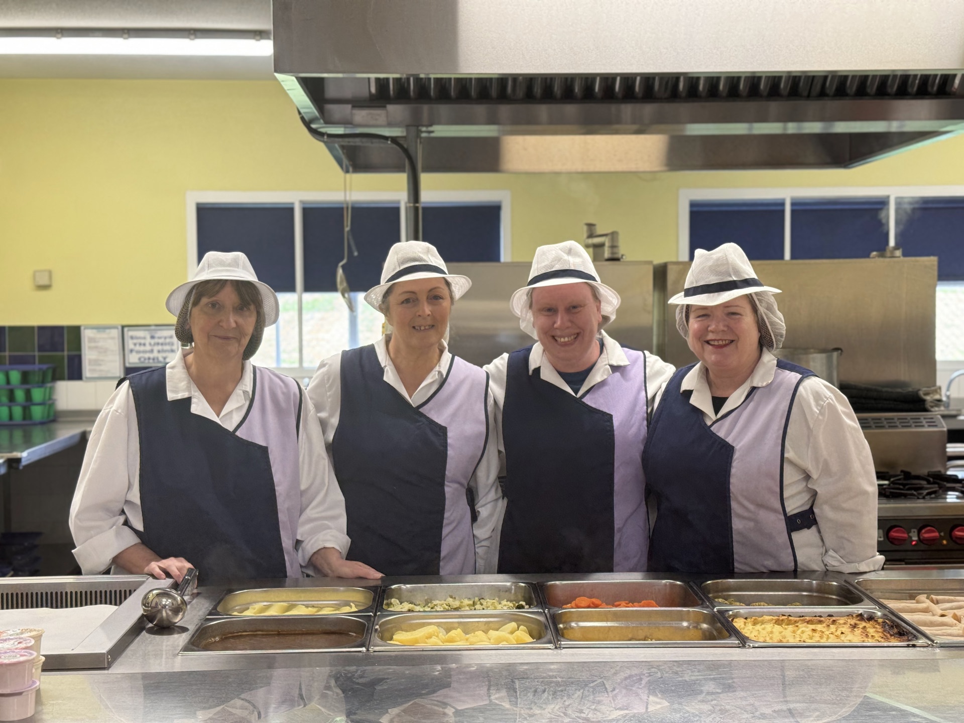 Catering staff in school kitchen