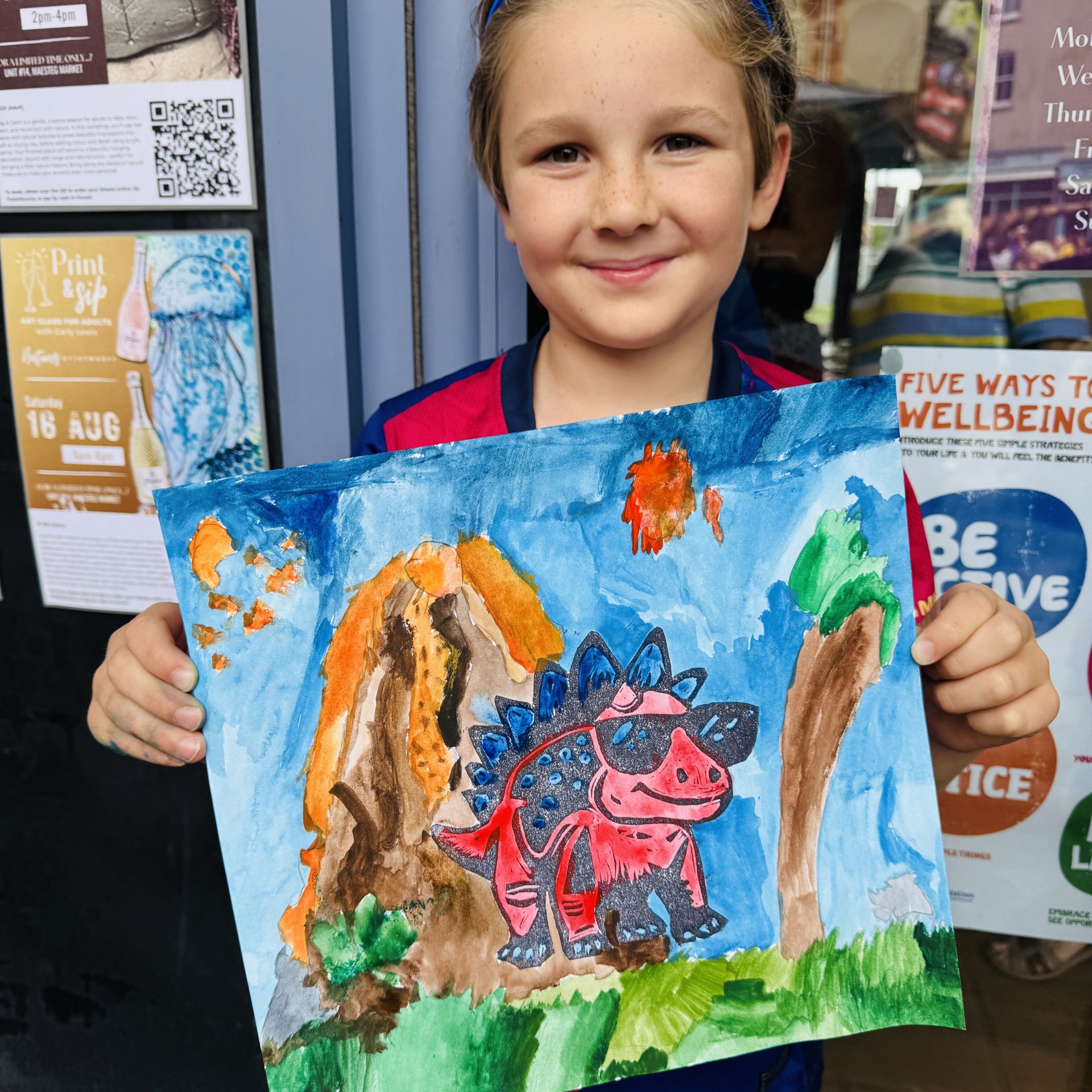 Jacob with his lino-print of dinosaur Roary.