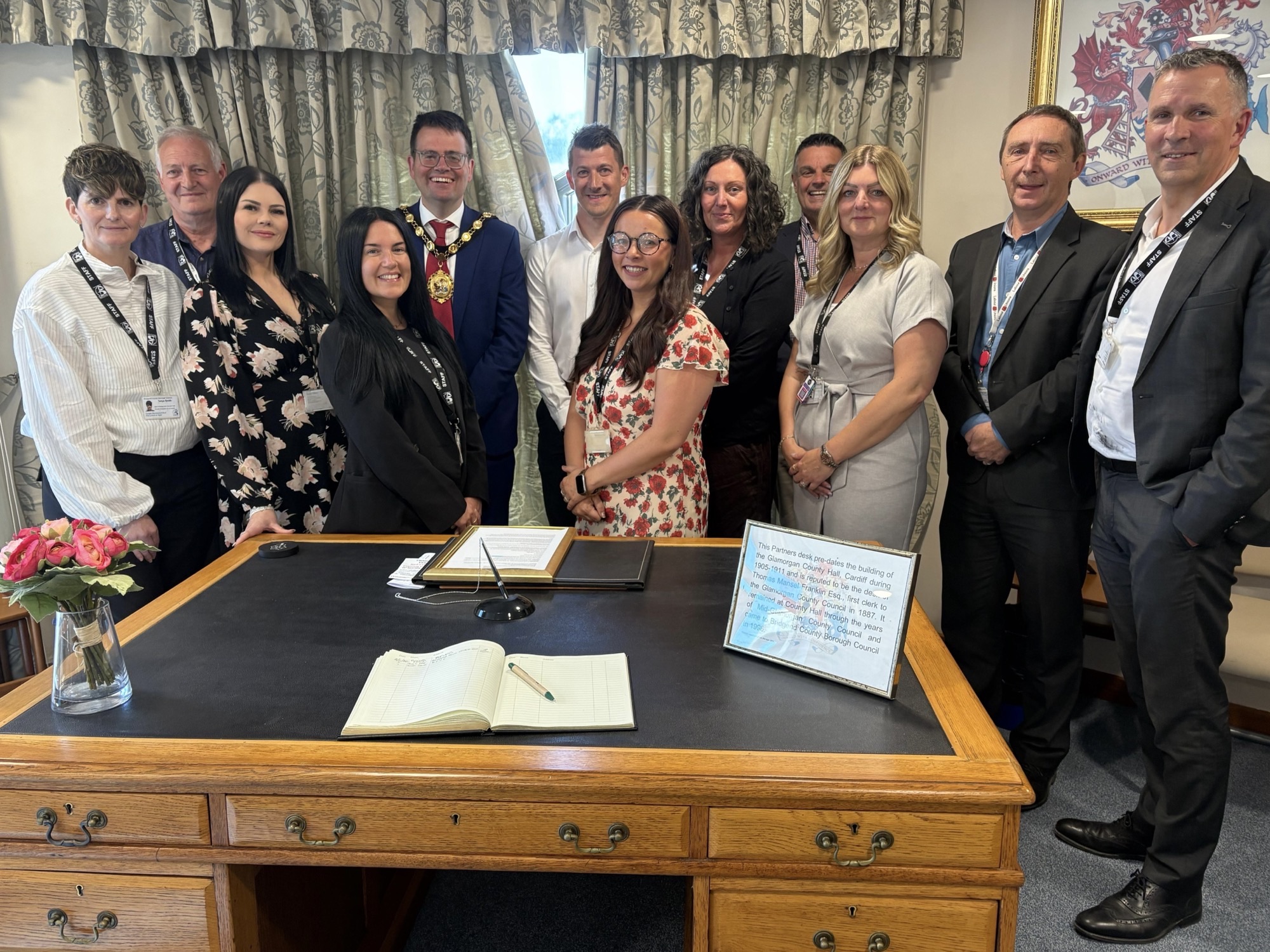 Image of the Youth Support Team with the council's Mayor, Cabinet and Chief Executive