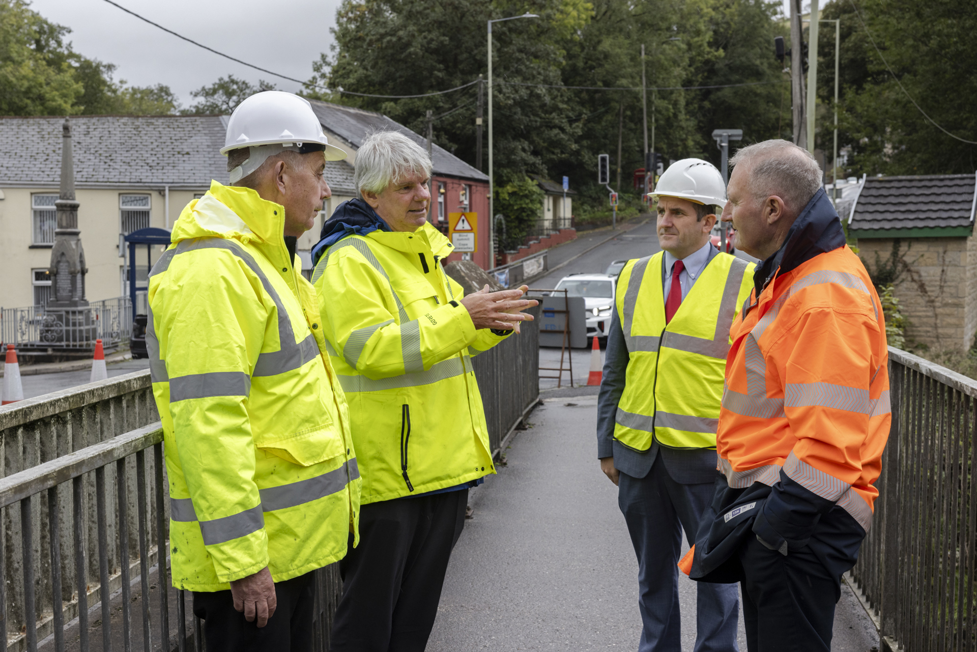 Dave Daniel of Centregreat Limited and Jason Jenkins of Bridgend County Borough Council discuss the plans to replace the top deck of the A4061 river bridge at Blackmill with Cllr Eugene Caparros and Cllr Hywel Williams. 