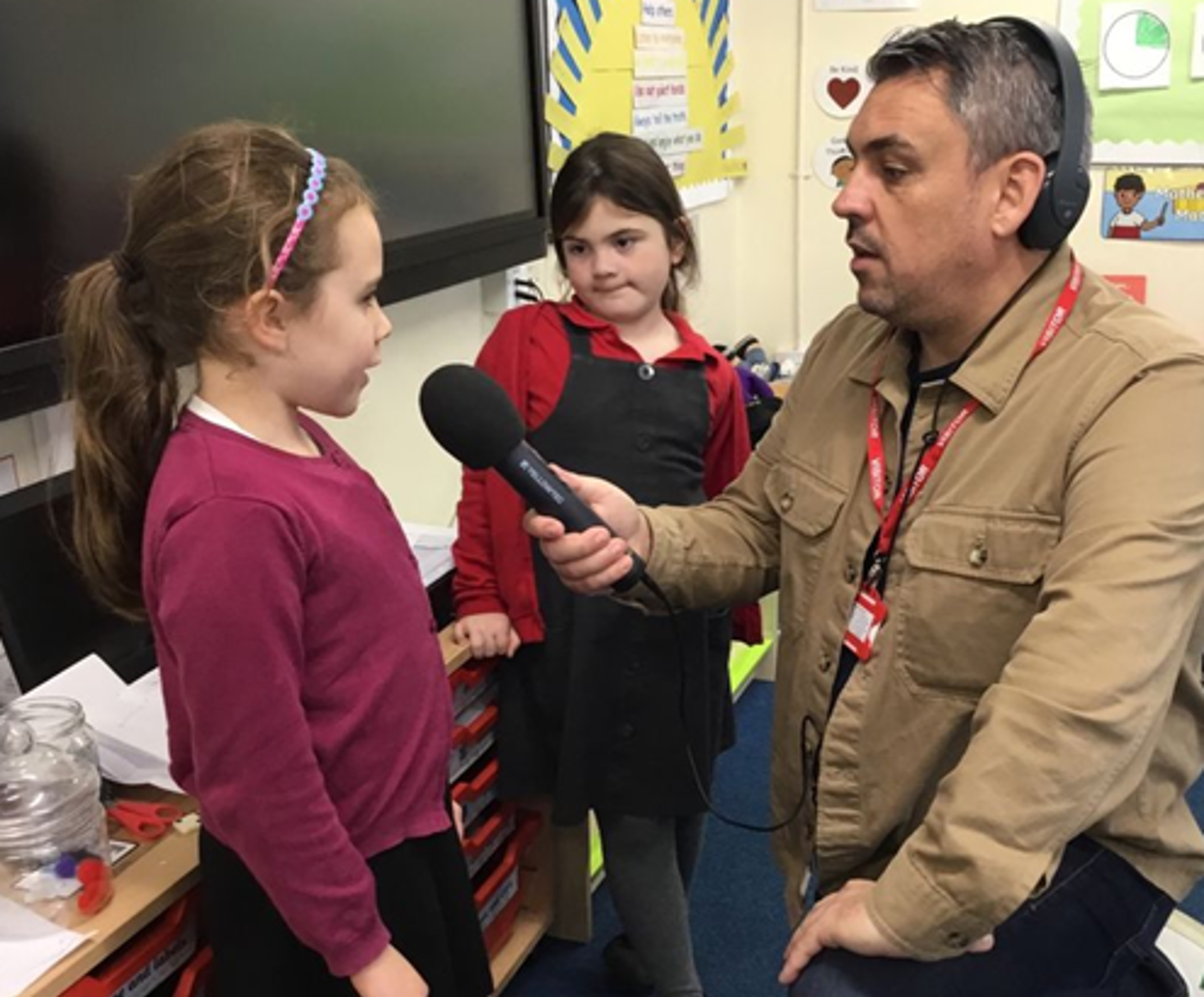 Tondu pupil talks into microphone