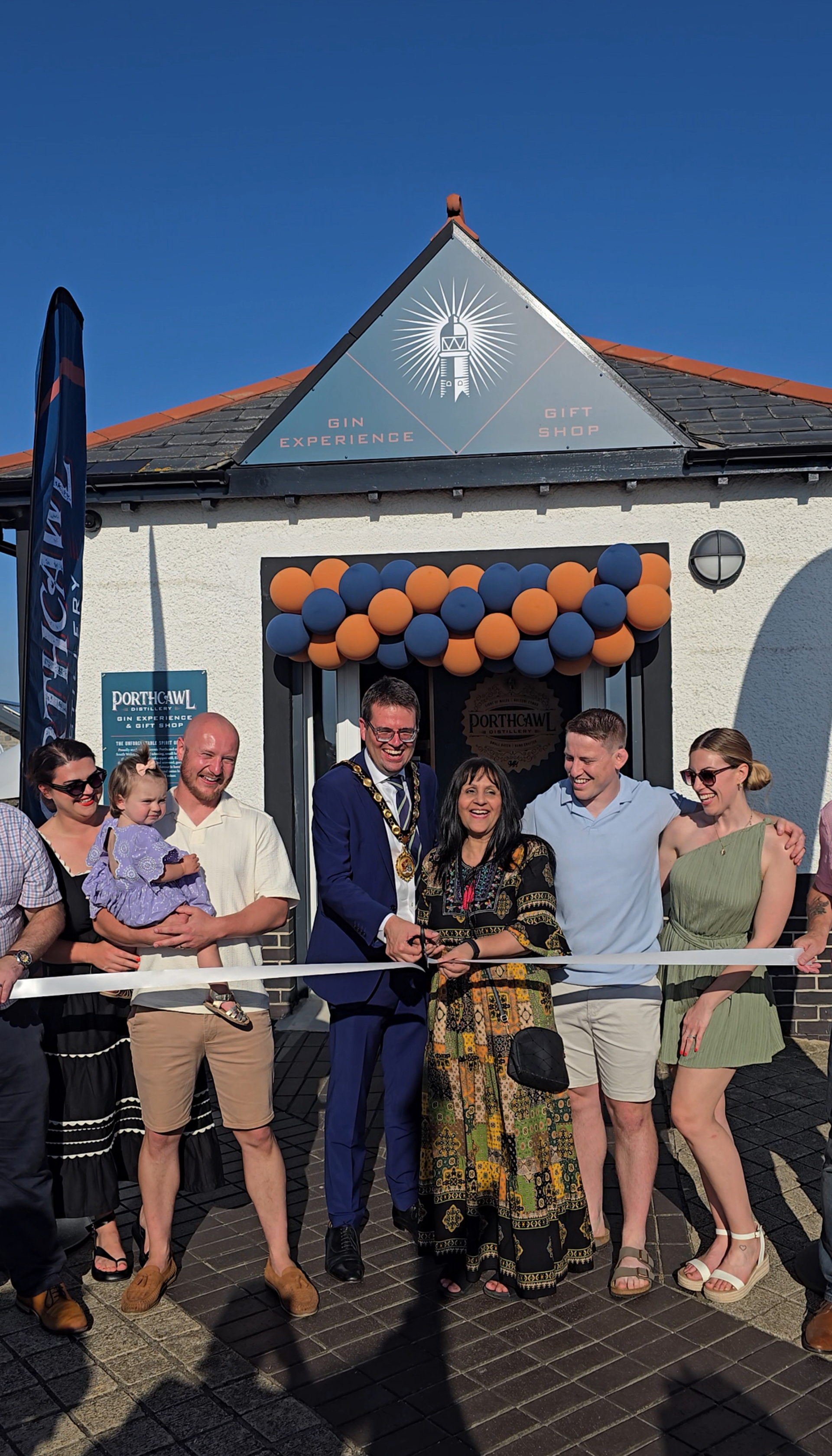 Glenn, Chris and their families with the Mayor of Bridgend County Borough Cllr Huw David and Cabinet Member, Cllr Neelo Farr at the official opening of their premises.