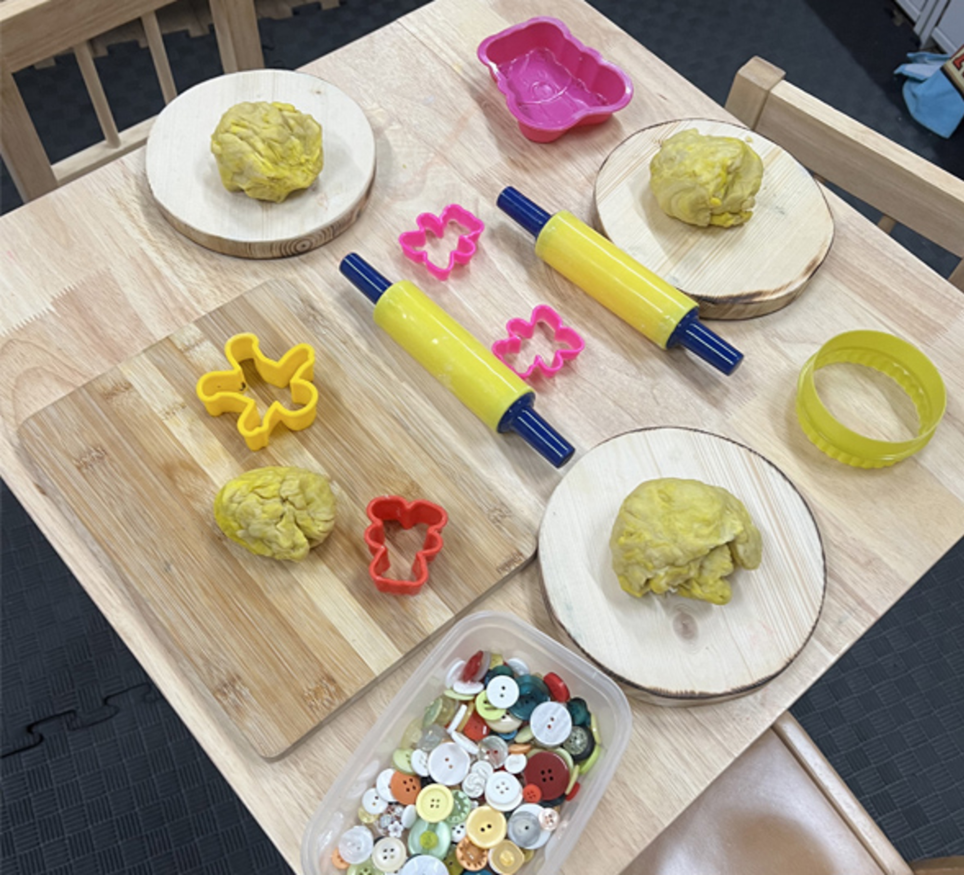 Playdoh with cookie cutters on table