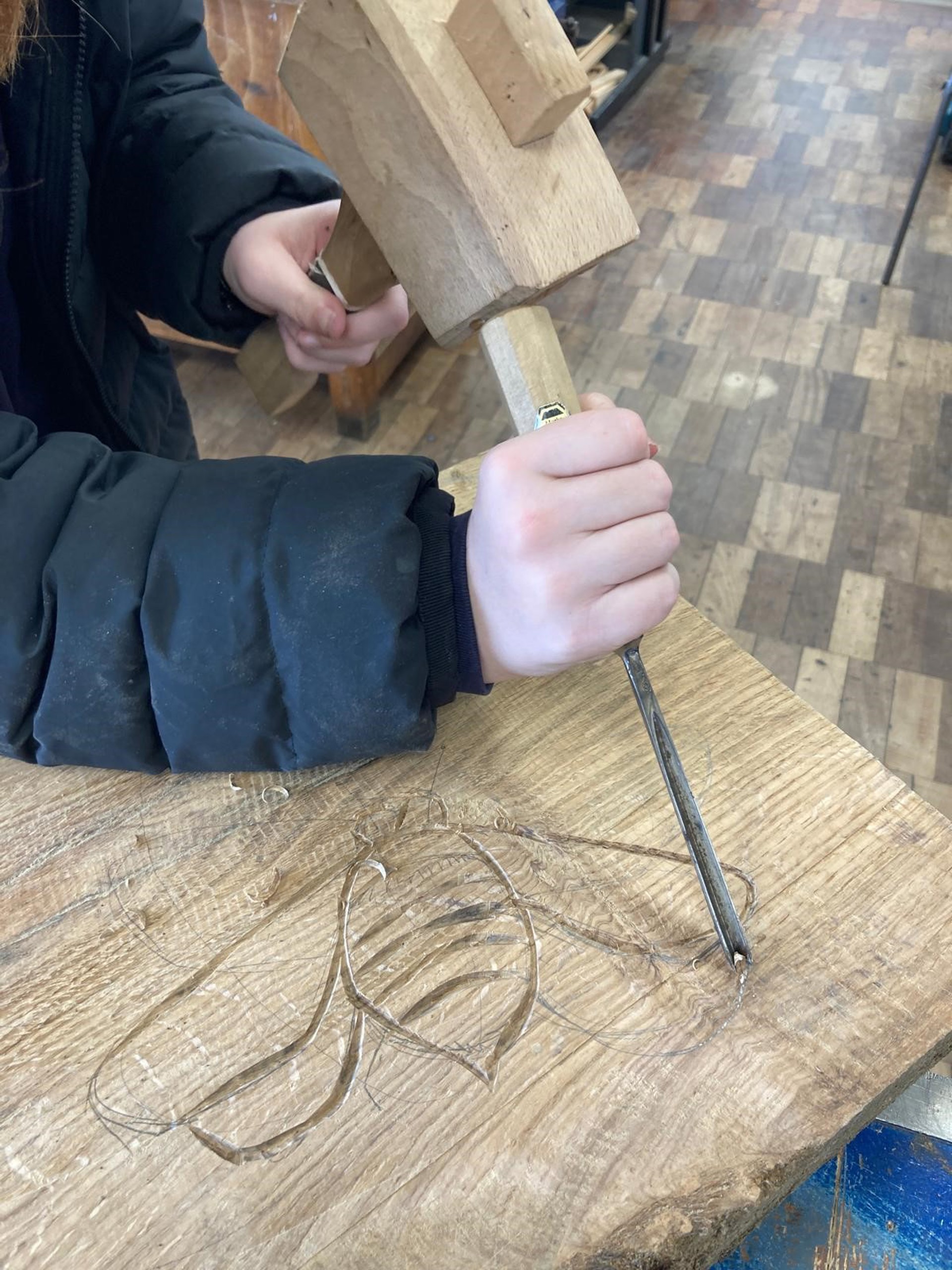 Panels designed and carved by pupils at Cynffig Comprehensive School for the benches at Bedford Park Nature Reserve.